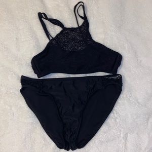 Top is island soul not sure on bottoms, both full black and have “mesh” spots